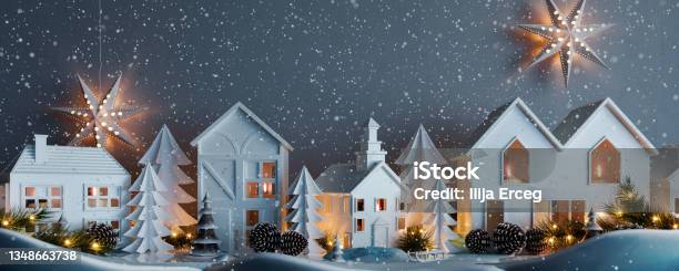 Christmas Snowy Night With White Paper Houses And Fir Tree Decoration Stock Photo - Download Image Now