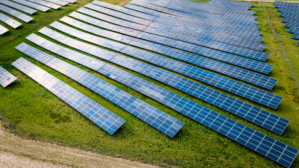 istock Big and blue photovoltaic farm as a renewable energy source. 1348663862