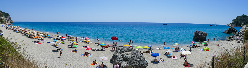Varigotti, Italy - 10-07-2021: Extra wide view of the Beach of Malpasso in Varigotti