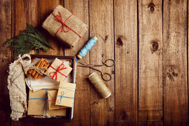 istock Christmas, New Year composition with gift boxes on wooden table. Preparing for the winter holidays 1348667286