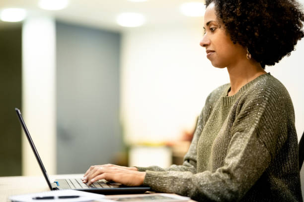 istock Woman working on laptop in office 1348671612