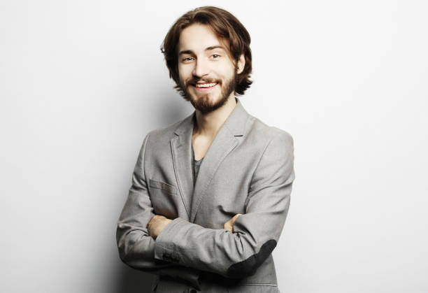 istock Portrait of young man posing over white background 1348673056