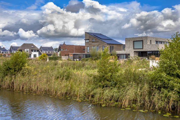 istock Neighborhood with ecological houses in natural setting 1348673711