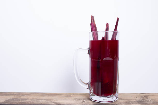 istock purple carrot pickled juices on white background 1348674326