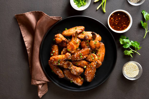 honig-soy chicken wings - korean culture stock-fotos und bilder