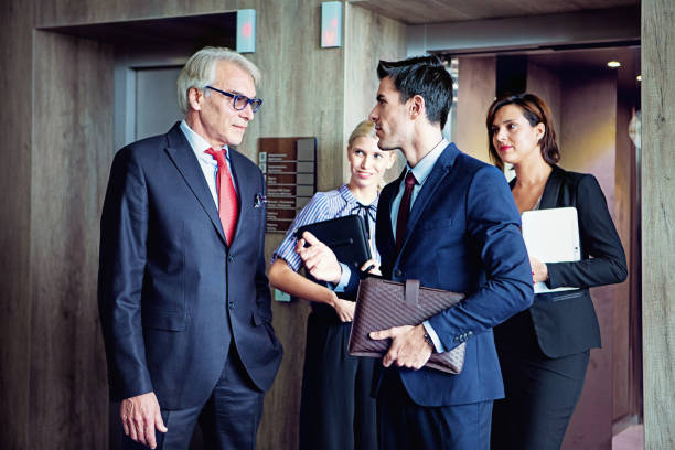 istock Coworkers are exiting from the elevator in a company building 1348675350