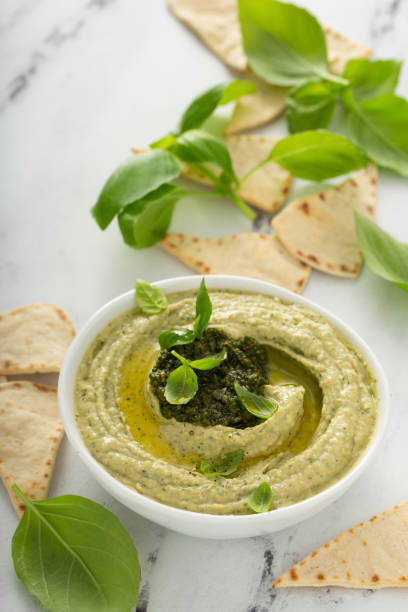 istock Basil hummus topped with pesto 1348677025