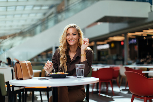 Portrait of beautiful woman eating healthy meal