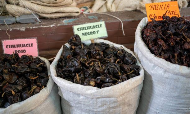 Bags filled with chiles in market stock photo