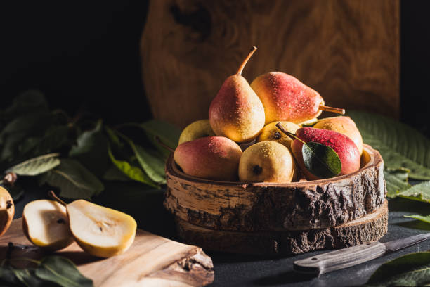 istock juicy ripe pears on a wooden plate 1348680684