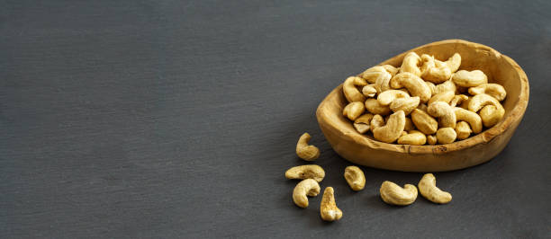 istock Bowl of cashew with copy space 1348691400