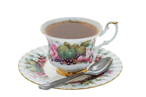 Antique cup and saucer containing hot tea