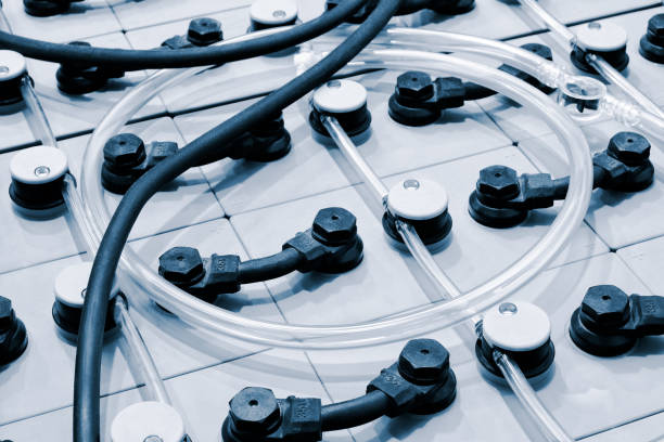 istock Selective focus of Electric car lithium battery pack and wiring connections internal between cells on background. 1348710115