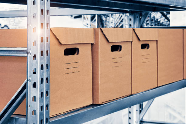 istock warehouse interior with cardboard boxes on shelves close up 1348713275