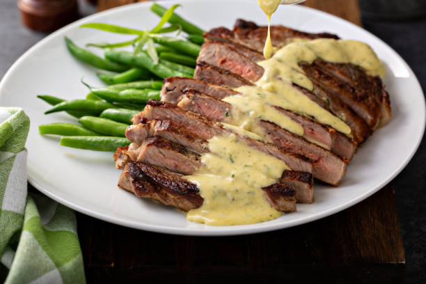 Steak with bearnaise sauce with tarragon Steak with bearnaise sauce made with tarragon tarragon horizontal color image photography stock pictures, royalty-free photos & images