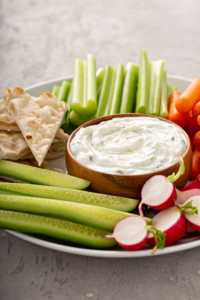 istock Large snack board with tzatziki dip or sauce and fresh vegetables 1348716539