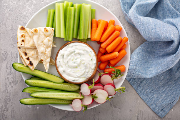 istock Large snack board with tzatziki dip or sauce and fresh vegetables 1348716553