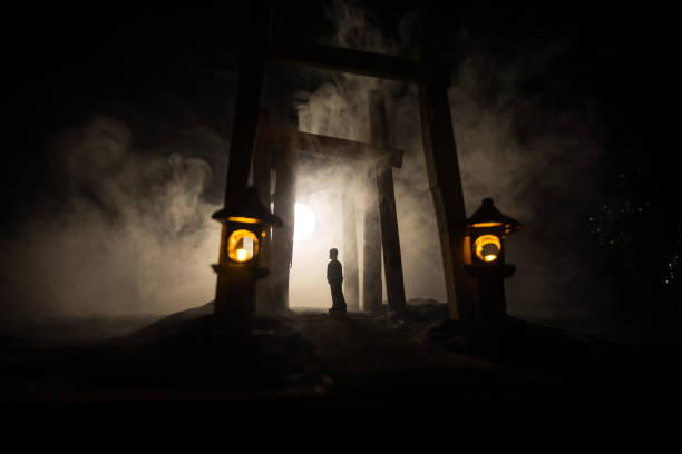 istock Creative artwork decoration. Abstract Japanese style wooden tunnel at night. Selective focus 1348716934