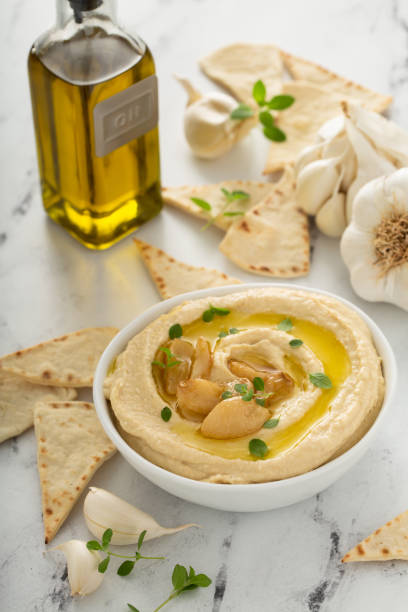 istock Roasted garlic hummus topped with olive oil 1348719541