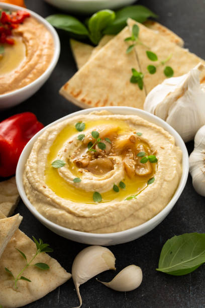 istock Roasted garlic hummus topped with olive oil 1348719553
