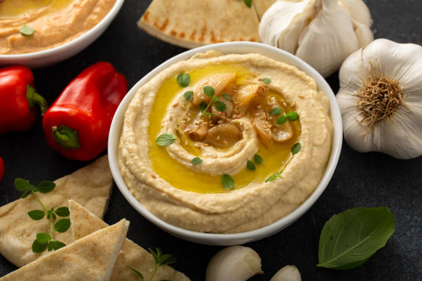istock Roasted garlic hummus topped with olive oil 1348719554