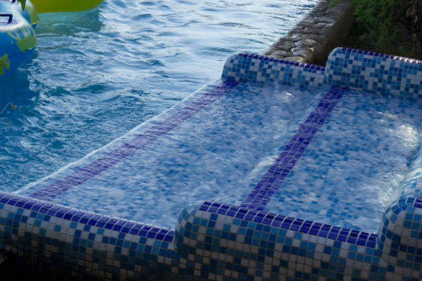 istock Water park. Water flows down the stairs in a specially designated place. 1348719565