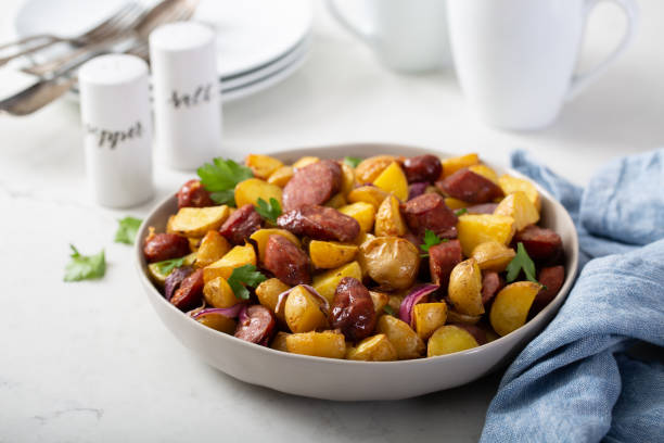 istock Traditional breakfast dish, potatoes with sausage 1348719567