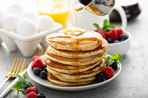 istock Fluffy buttermilk pancakes with syrup 1348719593