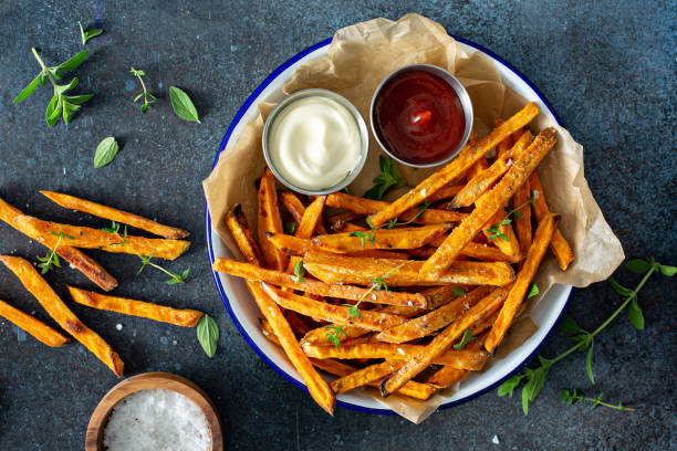 istock Sweet potato fries with sauces 1348719617