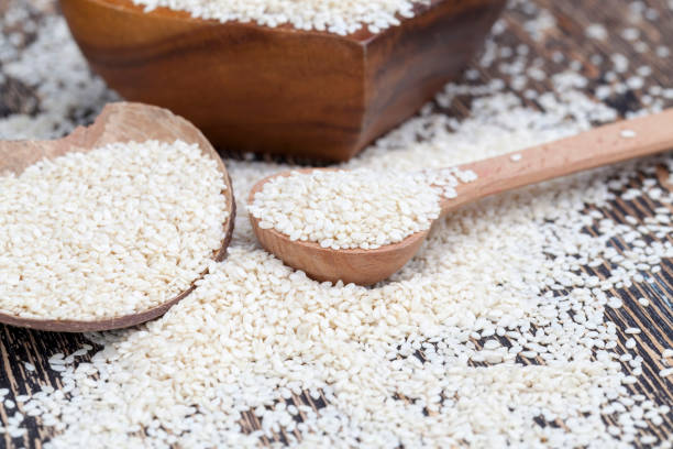 istock white sesame seeds on a wooden table 1348719693