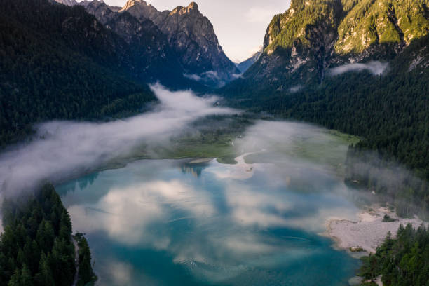 istock Beautiful morning fog over  Toblachersee And Mountains 1348751252