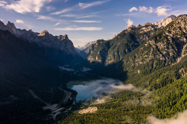 istock Beautiful morning fog over  Toblachersee And Mountains 1348751253