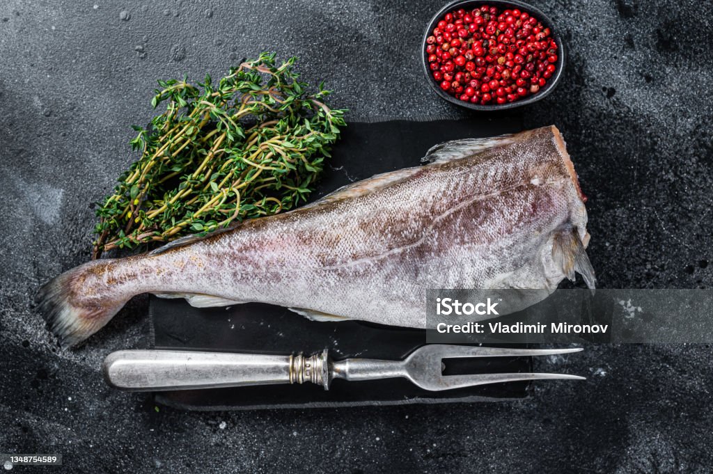 Fresh Whole Cod Uncooked Raw Cod Whole Fish On Marble Board With Thyme Black Background ...