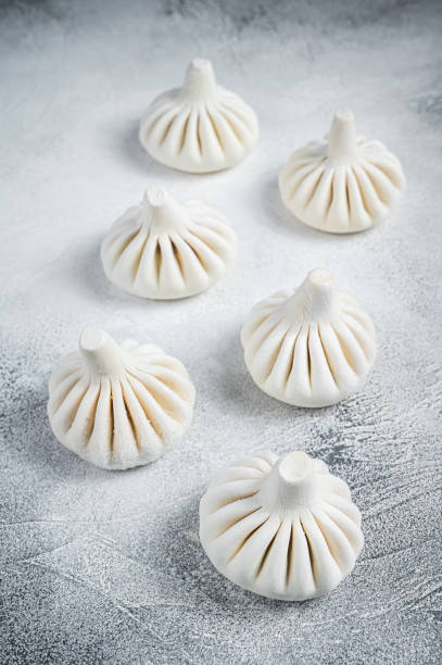 istock Georgian Raw dumpling Khinkali with meat. White background. Top view 1348756376