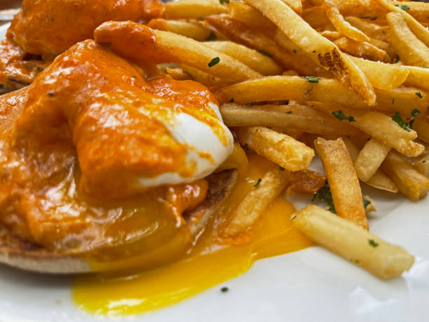Lobster Benedict with Fries and Broken Yolk
