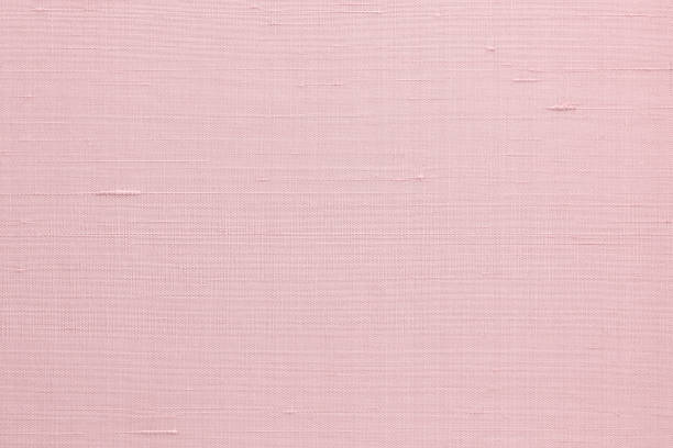 istock Silk fabric wallpaper texture pattern background in light pale sweet pink rose color 1348768156