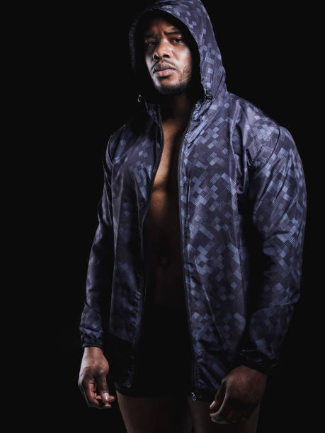 istock Studio portrait of a fit young man posing against a black background 1348772238