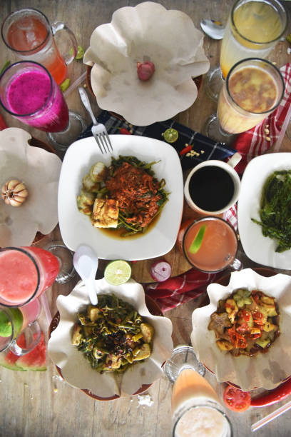 istock Mix foods and drinks placed on the brown wooden table 1348773001