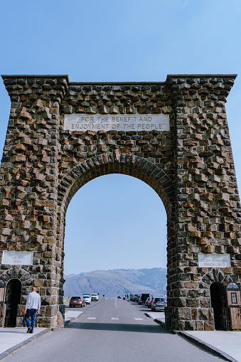 Gardiner, Montana, USA. Sep 04 2021: The Roosevelt Arch is located at the north entrance of Yellowstone National Park and was laid by President Theodore Roosevelt in 1903.