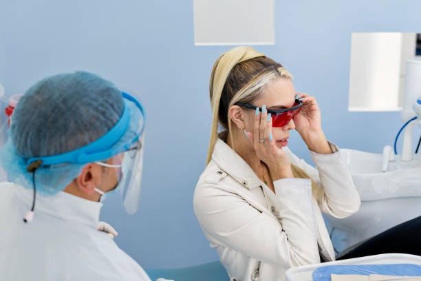 istock Female patient at the dentist 1348786192