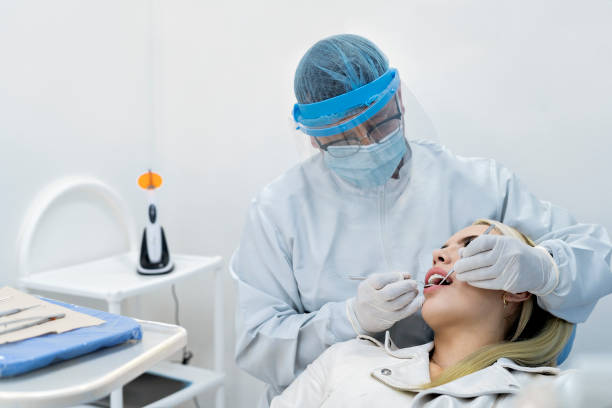istock Female patient at the dentist 1348786322