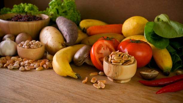 istock Background of various healthy vegetables on wooden table. 1348814785