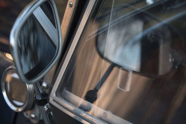 istock side mirror and window of classic car 1348814989