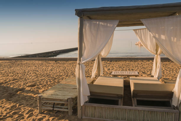 istock romantic covered lounger on the beach 1348817210