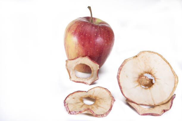 istock ripe apple with dried fruit slices isolated on white 1348819293