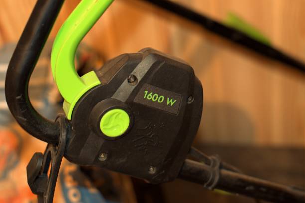 istock Gas handle on an electric lawn mower 1348821194