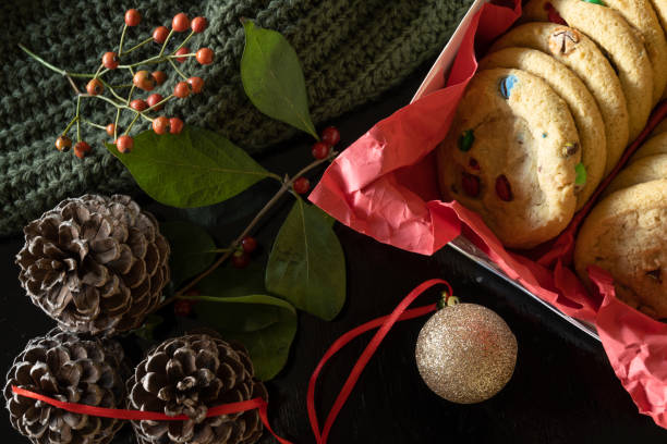 istock Top view of cookies surrounded by Christmas decorations. 1348822075