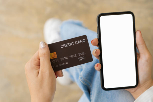 istock Concept image of credit card and cell phone with blank screen concept. Online payments and financial transactions 1348830708