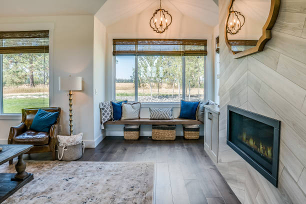 Floating bench near window with blue and white throw pillows