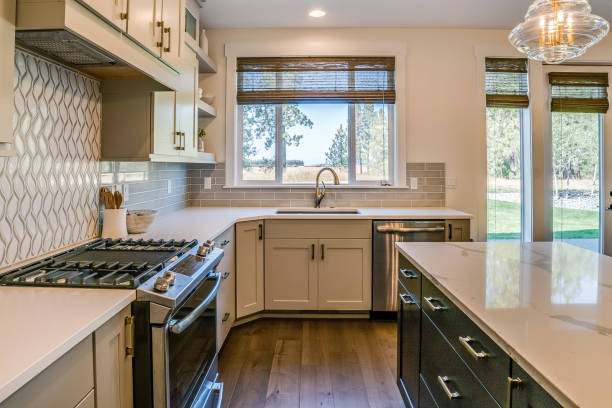 istock Quartz countertop and white cabinets in new kitchen 1348833321